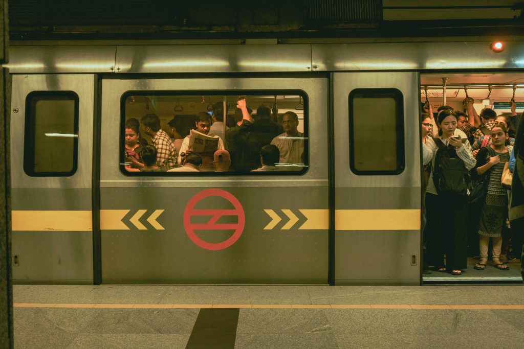 Image of a crowded metro train in Delhi. 