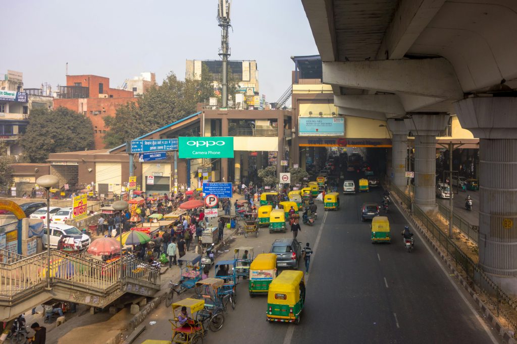 Autos and e-rickshaws crowded along the footpath and exit at the Laxmi Nagar metro station, in Delhi. 